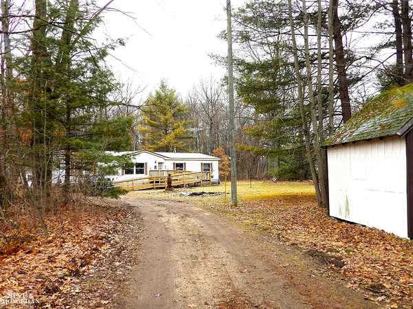 2.5 Acres of Land with Home for Sale in White Cloud, Michigan