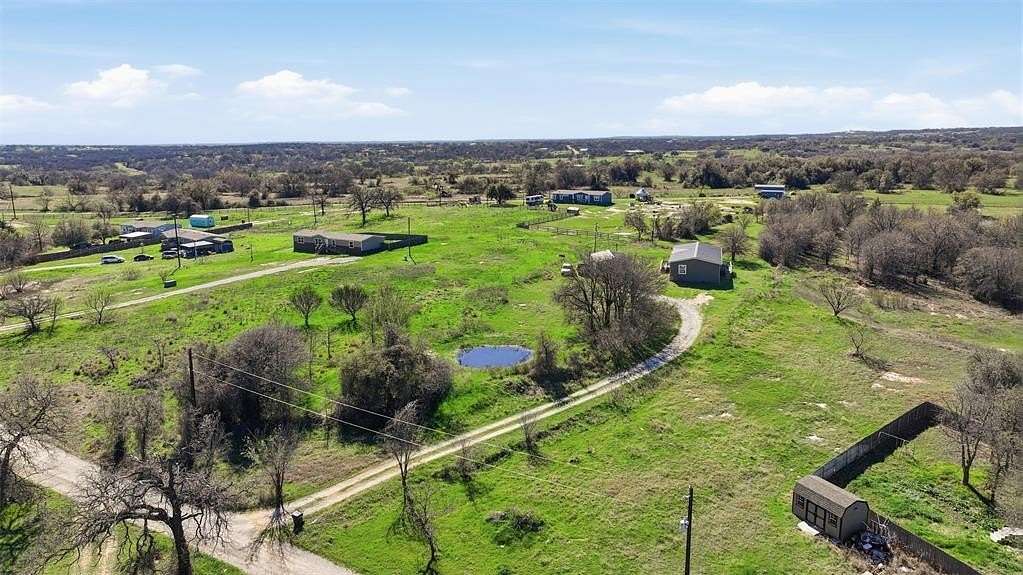 3.1 Acres of Land with Home for Sale in Springtown, Texas