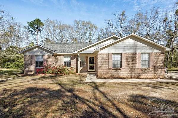 4.38 Acres of Land with Home for Sale in McDavid, Florida