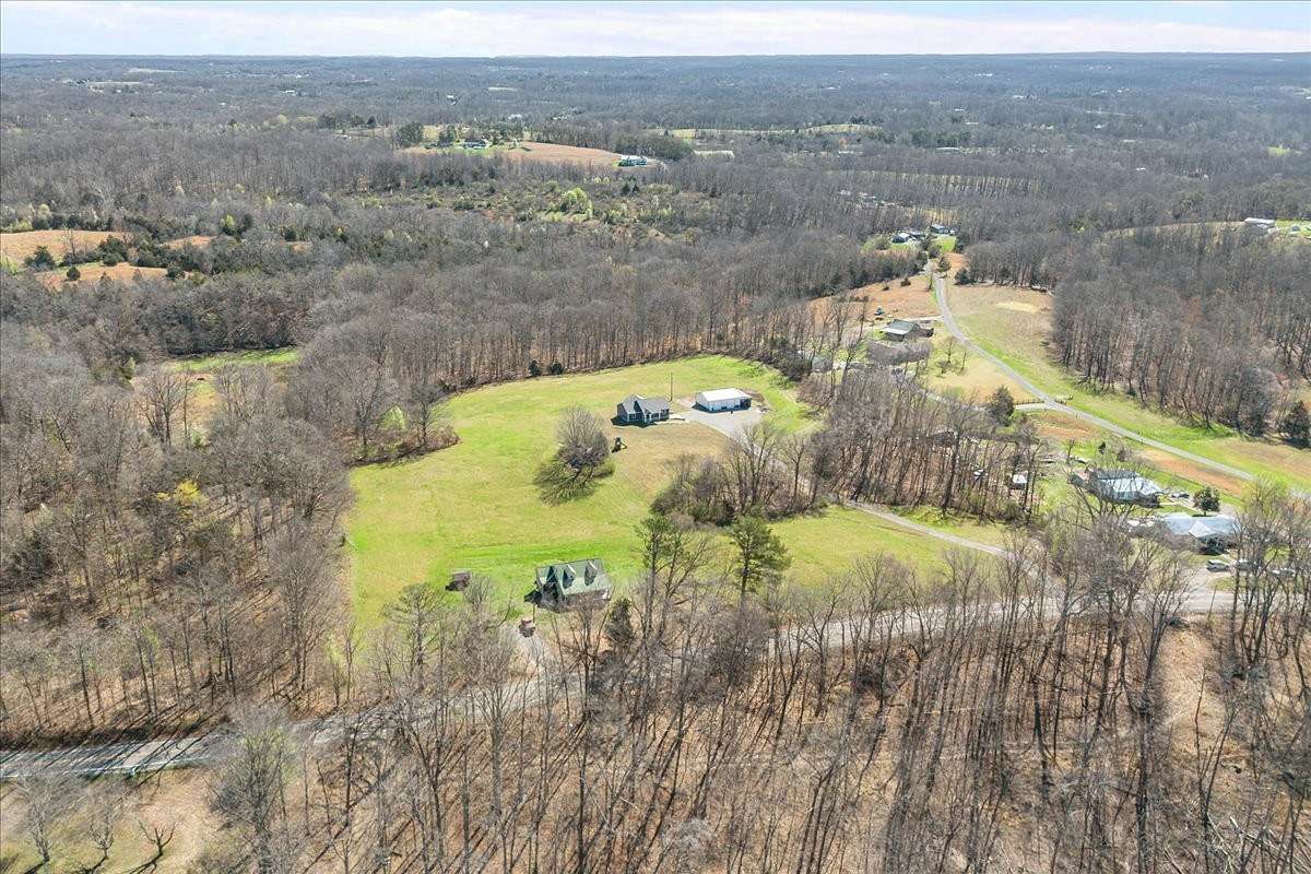 10.9 Acres of Recreational Land with Home for Sale in Bon Aqua, Tennessee