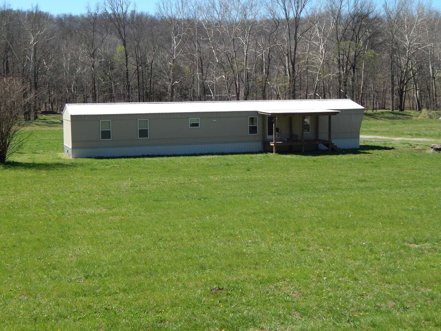 13.7 Acres of Recreational Land with Home for Sale in Clifton, Tennessee