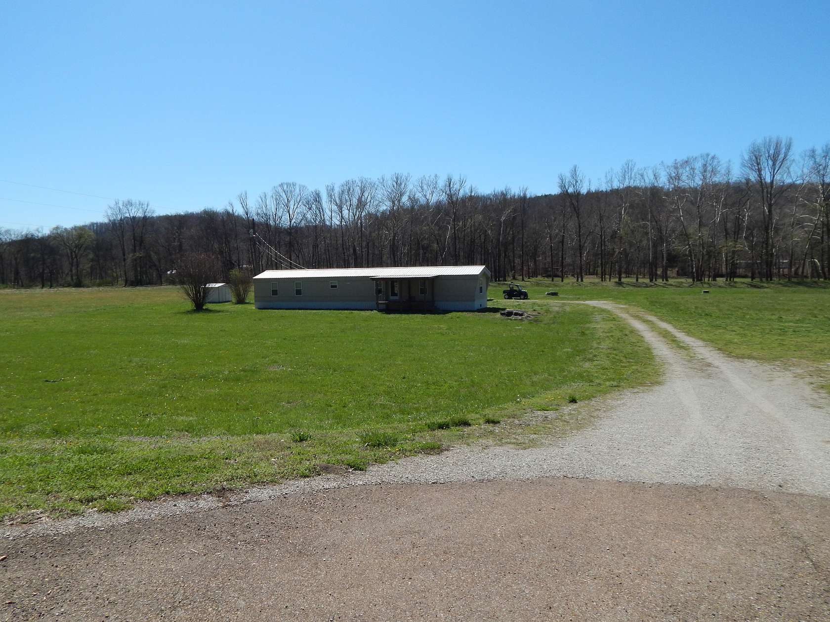 13.7 Acres of Recreational Land with Home for Sale in Clifton, Tennessee