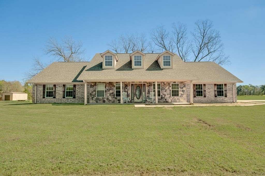 54 Acres of Land with Home for Sale in Elkhart, Texas