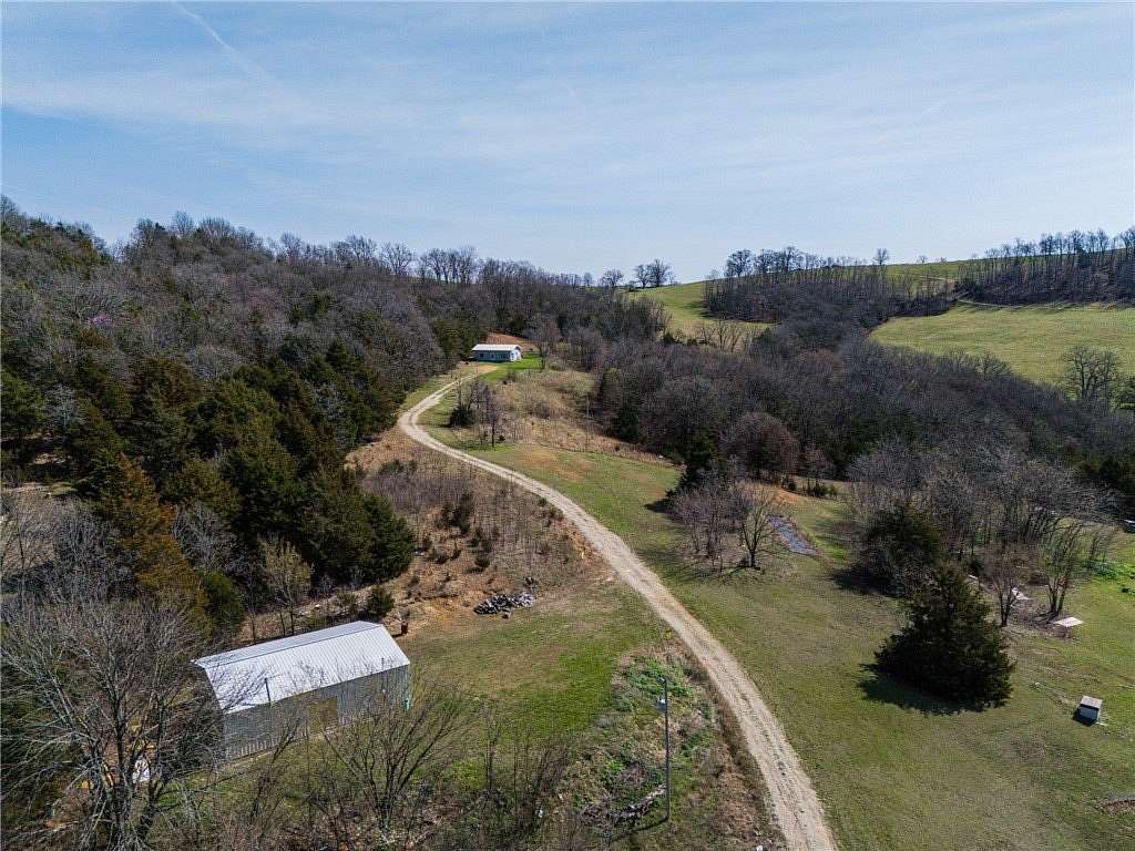 7.44 Acres of Land with Home for Sale in Berryville, Arkansas
