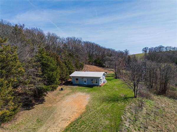 7.44 Acres of Land with Home for Sale in Berryville, Arkansas