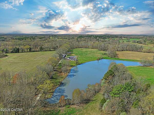 13.8 Acres of Land with Home for Sale in Atwood, Tennessee