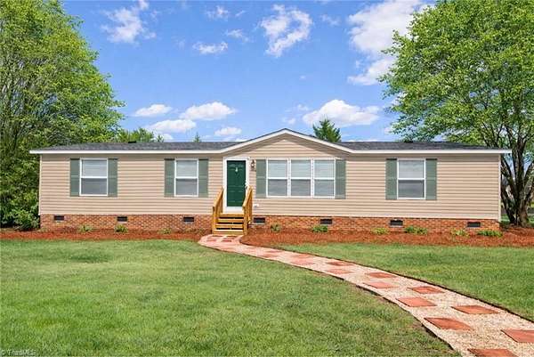 1.68 Acres of Land with Home for Sale in Oak Ridge, North Carolina