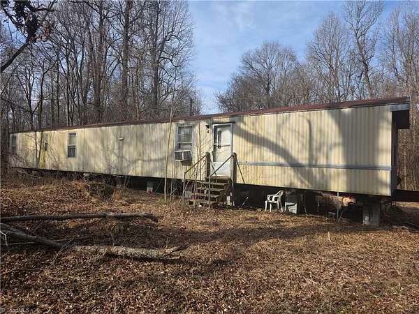 3.86 Acres of Land with Home for Sale in Snow Camp, North Carolina