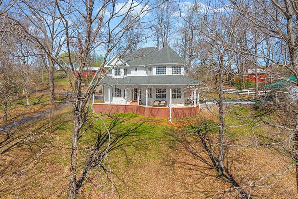 10.8 Acres of Land with Home for Sale in Adams, Tennessee