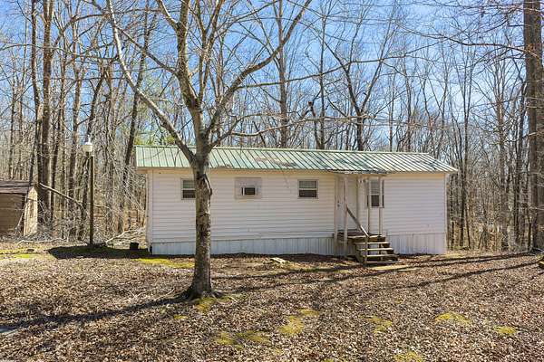 5.29 Acres of Land with Home for Sale in Bath Springs, Tennessee