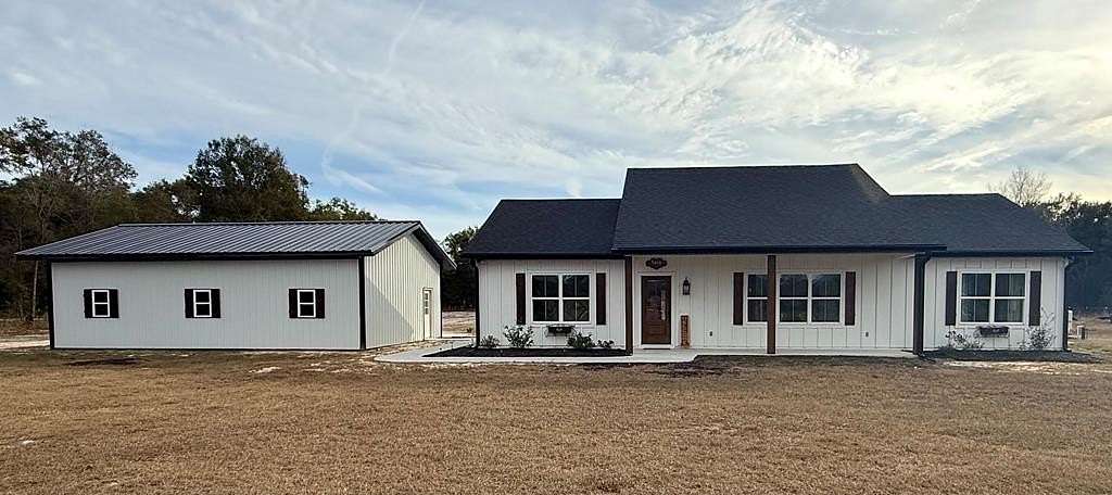 4.38 Acres of Land with Home for Sale in Chiefland, Florida