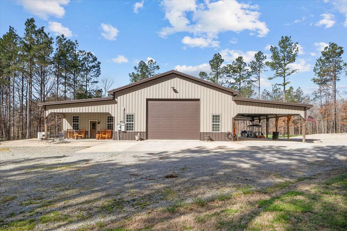 194 Acres of Land with Home for Sale in Scotts Hill, Tennessee