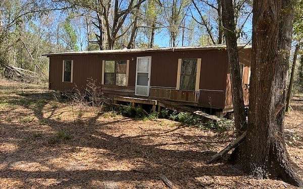 5.14 Acres of Land with Home for Sale in Live Oak, Florida