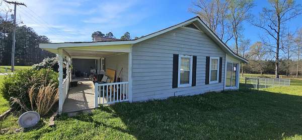 7.85 Acres of Land with Home for Sale in Kingsland, Arkansas