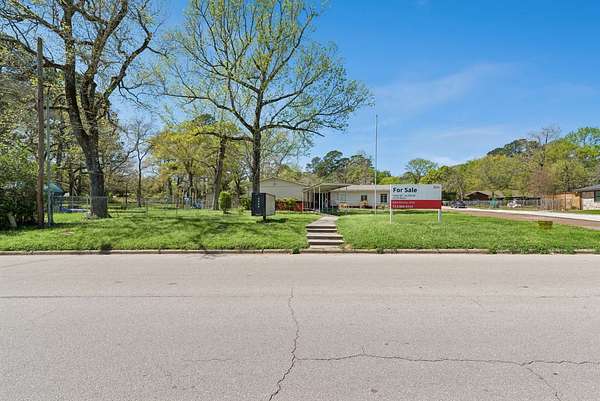 2.44 Acres of Improved Commercial Land for Auction in Huntsville, Texas