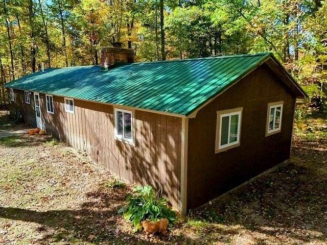 9.72 Acres of Land with Home for Sale in Whittemore, Michigan