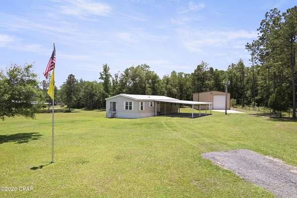 4.67 Acres of Land with Home for Sale in Caryville, Florida