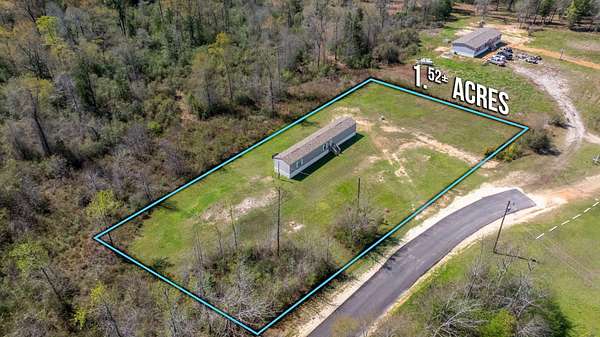1.59 Acres of Land with Home for Sale in Baker, Florida