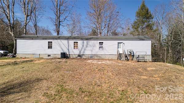 1.5 Acres of Land with Home for Sale in Boomer, North Carolina