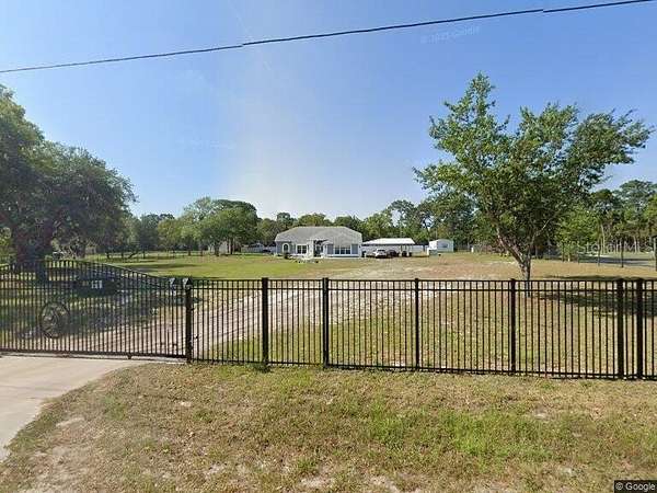 2.59 Acres of Land with Home for Sale in Spring Hill, Florida