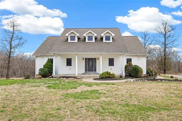 28 Acres of Land with Home for Sale in Gravette, Arkansas