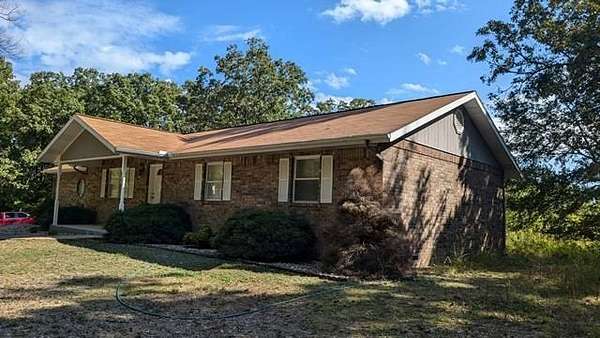 4 Acres of Land with Home for Auction in Lampe, Missouri