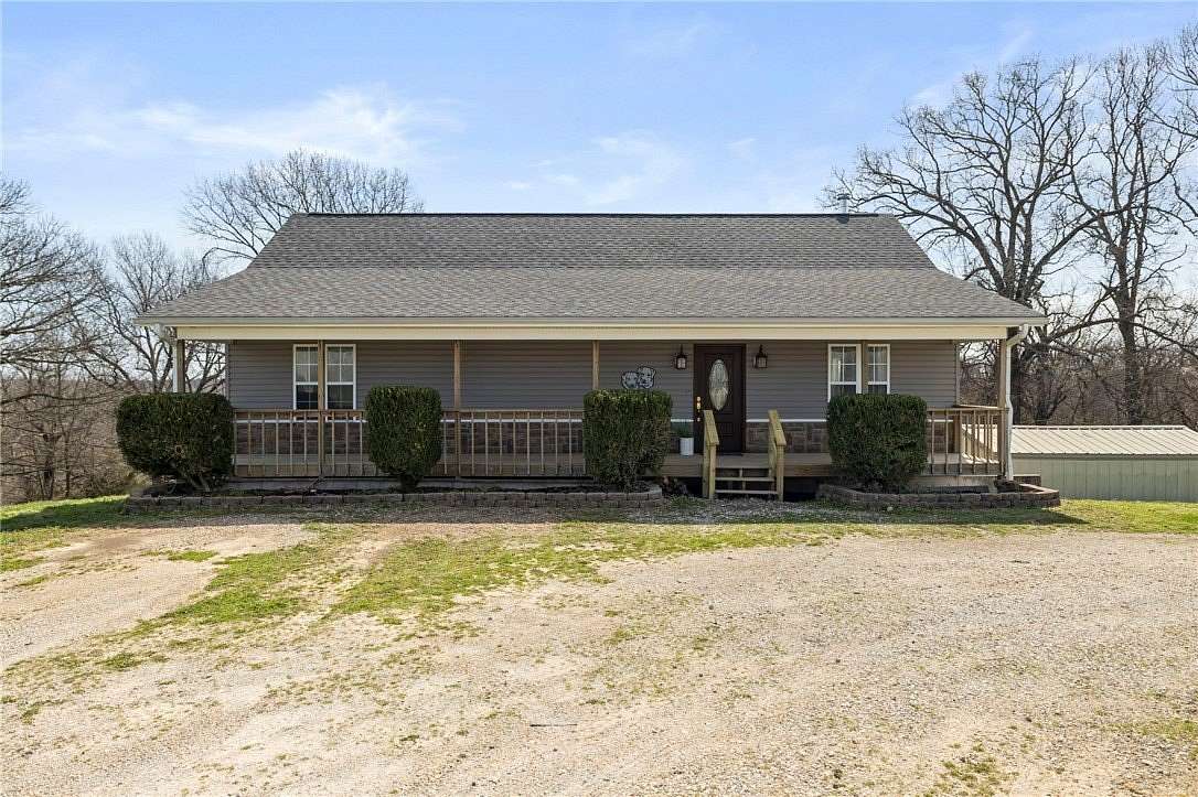 17.4 Acres of Land with Home for Sale in Garfield, Arkansas