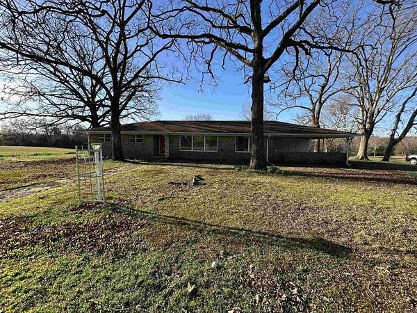 5.66 Acres of Land with Home for Sale in Mena, Arkansas