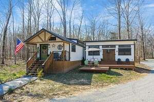 5 Acres of Land with Home for Sale in Lobelville, Tennessee