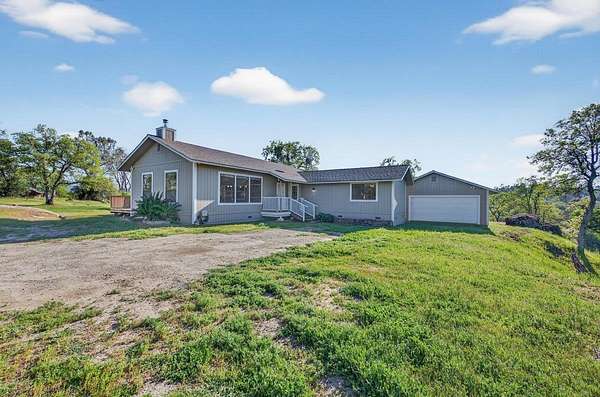 9.84 Acres of Land with Home for Sale in Auberry, California