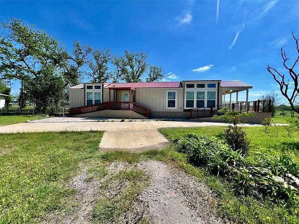 7.64 Acres of Land with Home for Sale in Carbon, Texas