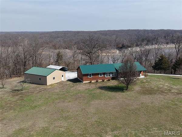 13.1 Acres of Land with Home for Sale in Perry, Missouri