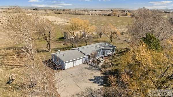 5.6 Acres of Land with Home for Sale in Rigby, Idaho