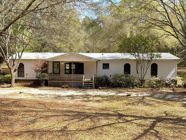 14.3 Acres of Land with Home for Auction in Metter, Georgia