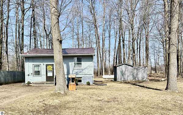 2 Acres of Land with Home for Sale in Six Lakes, Michigan