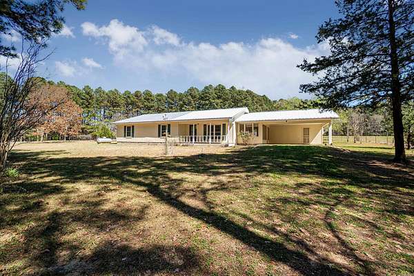 15.7 Acres of Land with Home for Sale in Junction City, Arkansas