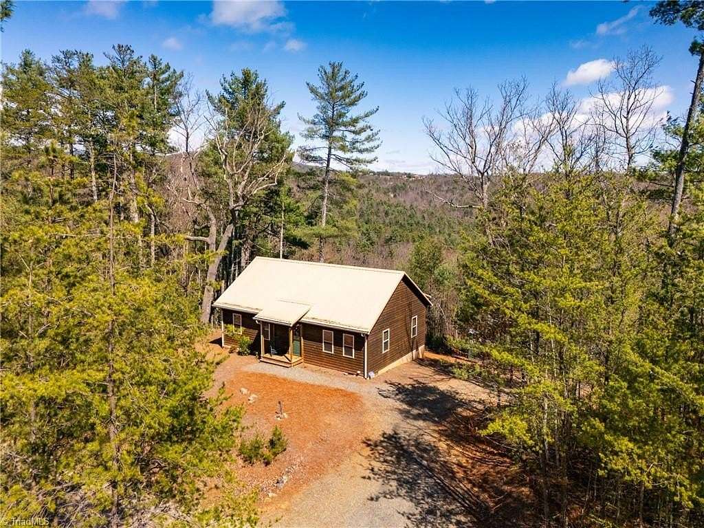 5.49 Acres of Land with Home for Sale in Purlear, North Carolina