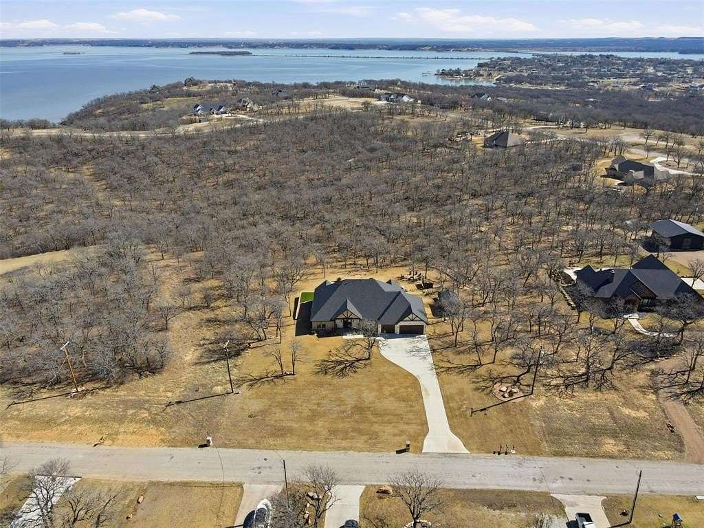 2.54 Acres of Land with Home for Sale in Runaway Bay, Texas