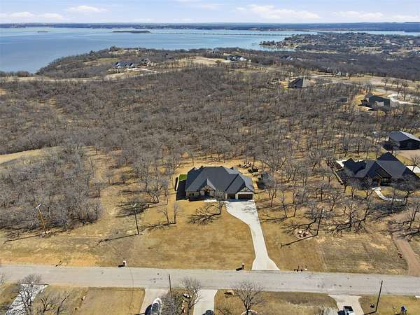 2.54 Acres of Land with Home for Sale in Runaway Bay, Texas