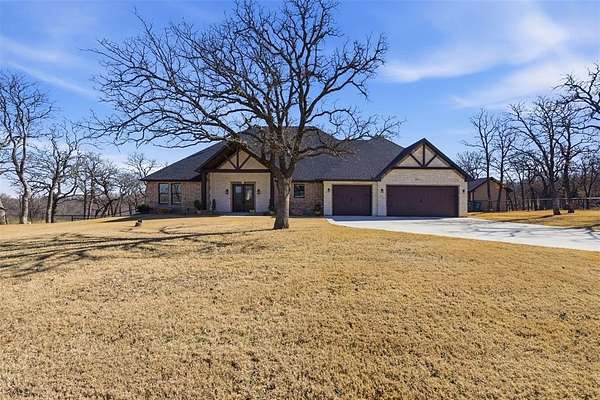 2.54 Acres of Land with Home for Sale in Runaway Bay, Texas