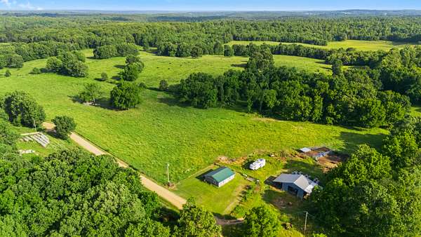 247 Acres of Land with Home for Sale in Koshkonong, Missouri