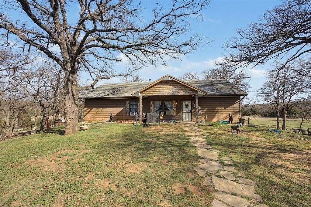 7.75 Acres of Land with Home for Sale in Harrah, Oklahoma