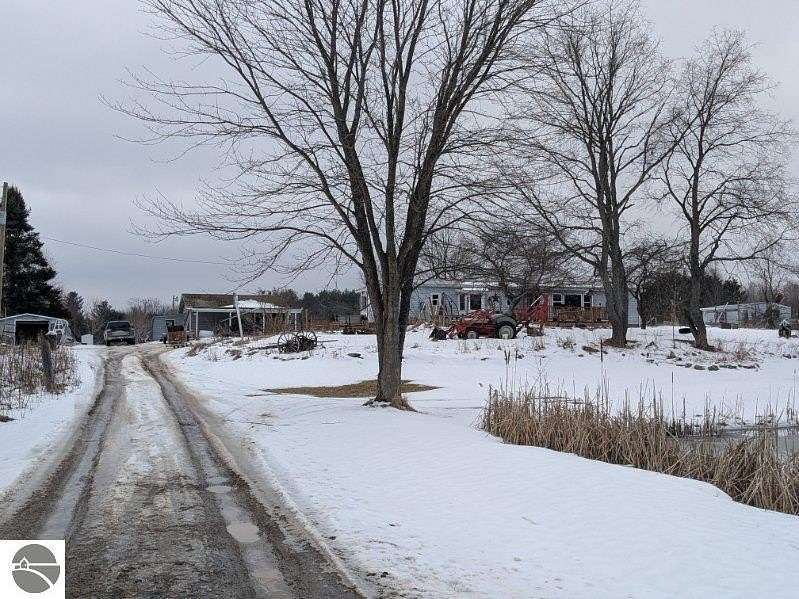 5 Acres of Land with Home for Sale in Whittemore, Michigan