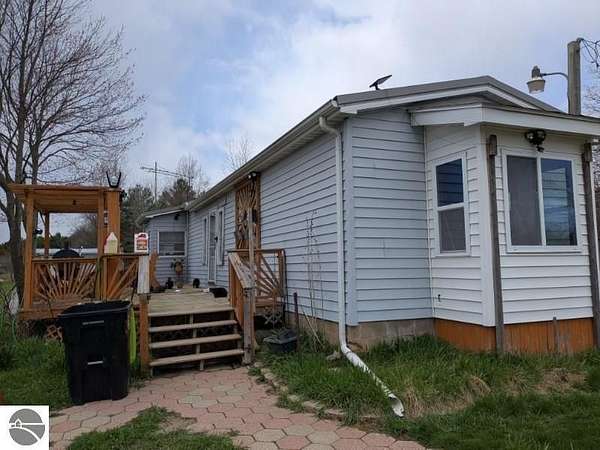 5 Acres of Land with Home for Sale in Whittemore, Michigan