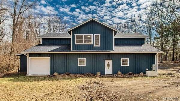 7.8 Acres of Land with Home for Sale in Hamburg Township, Michigan