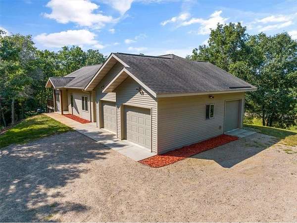 5.4 Acres of Land with Home for Sale in Breezy Point, Minnesota