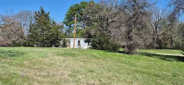 4.79 Acres of Land with Home for Sale in Boyd, Texas