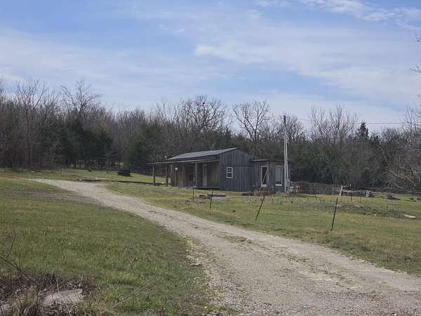 4.8 Acres of Land with Home for Sale in Louisburg, Missouri