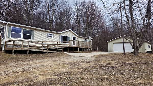 3 Acres of Land with Home for Sale in Edmore, Michigan