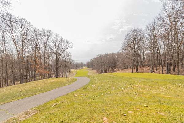 0.8 Acres of Residential Land for Sale in Canadian Lakes, Michigan